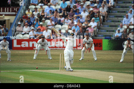 Hove UK 26 July 2013 - Australia batsman Phil Hughes hits the ball to the boundary for 4 runs against Sussex at Hove County Ground today . Hughes died in 2014 after being hit on the head by a ball . Stock Photo