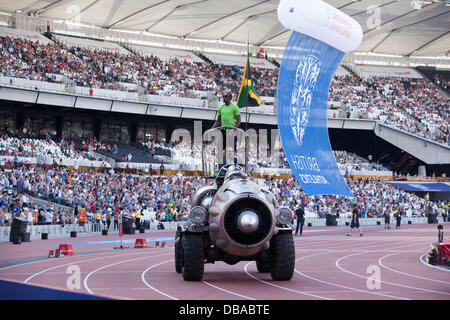 London, UK. 26th July, 2013. Usain Bolt enters Olympic Stadium on a rocket greeting fans. 100m Olympic Champion Usain Bolt stands next to Jamaican Flag on a rocket. Anniversary Games British Athletics in London. Photo: Credit: Rebecca Andrews/Alamy Live News Stock Photo