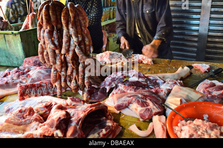 Meats being butchered at a Taiwanese food market. Stock Photo