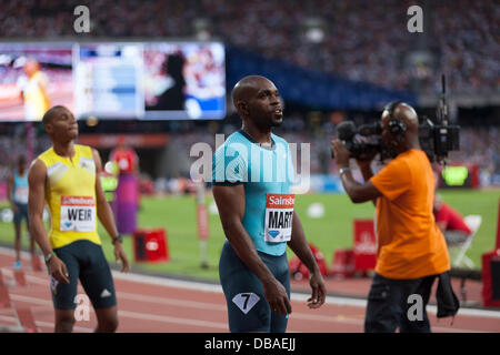London, UK. 26th July, athletes preparing for the 200m mens race, Warren Weir (left) 1st place, Anniversary Games British Athletics, London. 2013. Photo: Credit: Rebecca Andrews/Alamy Live News Stock Photo