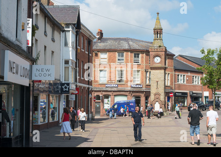 Clock Tower and people walking within the pedestrianised centre of Ormskirk, north west England, UK Stock Photo