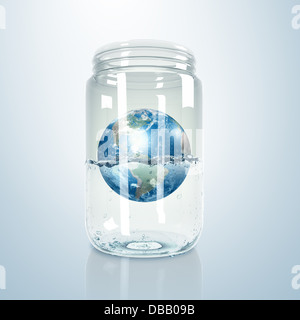 Planet earth inside glass jar Stock Photo - Alamy