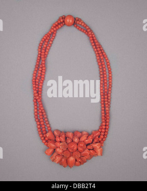 This suite consists of a choker, bracelet, brooch, and earrings, showcasing elegant design and craftsmanship in jewelry. The collection is a notable example of luxury adornments, crafted with attention to detail in various materials, including bronze and other metals. The set reflects the fusion of aesthetic beauty and functional design within the realm of jewelry making. Stock Photo