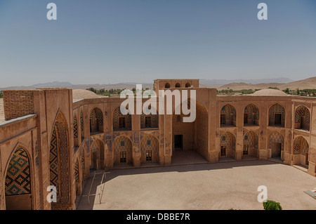 view of courtyard showing windcatcher, the Timurid madrasa of Khargird, Khorasan, Iran Stock Photo