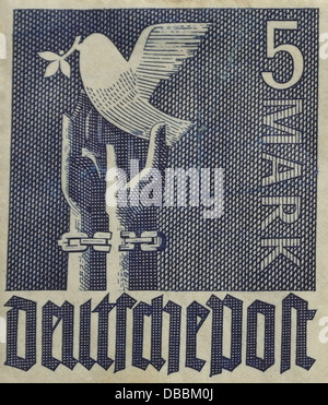 Blue 5 marks 'Peace Dove' postage stamp, with peace dove rising from broken shackled hands, issued in Germany, 1947 Stock Photo