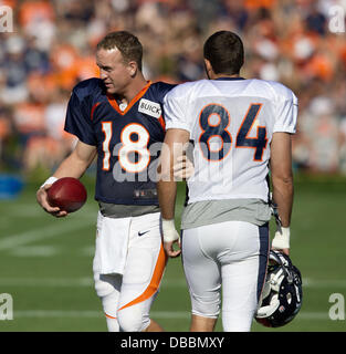 Englewood, Colorado, USA. 27th July, 2013. Denver Broncos QB PEYTON MANNING, left, gets the attention of TE JACOB TAMME, right, before the start of drills during Training Camp at Dove Valley Saturday Morning. Credit:  Hector Acevedo/ZUMAPRESS.com/Alamy Live News Stock Photo