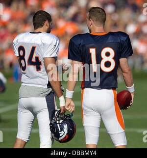 Englewood, Colorado, USA. 27th July, 2013. Denver Broncos TE JACOB TAMME, left, talks route information with QB PEYTON MANNING, right, before the start of drills during Training Camp at Dove Valley Saturday Morning. Credit:  Hector Acevedo/ZUMAPRESS.com/Alamy Live News Stock Photo