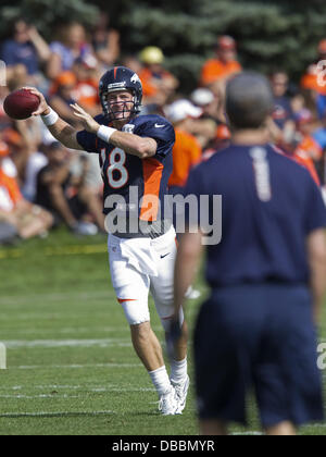 Englewood, Colorado, USA. 27th July, 2013. Denver Broncos QB PEYTON MANNING, left, readies to make a pass as he goes through drills during Training Camp at Dove Valley Saturday Morning. Credit:  Hector Acevedo/ZUMAPRESS.com/Alamy Live News Stock Photo
