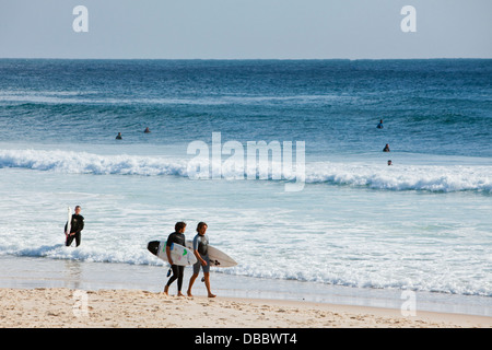 Surfers on the beach at Burleigh Heads. Gold Coast, Queensland, Australia Stock Photo