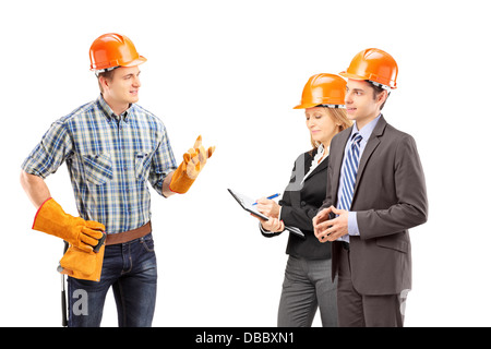 Manual worker having a conversation with architects Stock Photo