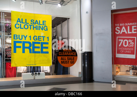 Scottish Indoor shopping All-Sale Clothing; Buy-One-Get-One-Free at a Great price. Buy 1 Get 1 free clearance Bogof offers in Inverness, Scotland, UK Stock Photo