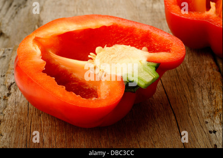 Cross section red bell pepper on wooden background Stock Photo