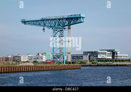 The Titan Crane in Clydebank Scotland on the site of the old John Brown shipyard viewed from the River Clyde & Clydebank College Stock Photo