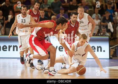 Goettingen, Germany. 27th July, 2013. Niels Giffey (R) plays against Portugal's Joao Santos during the international basketball match Germany vs. Portugal at S-Arena in Goettingen, Germany, 27 July 2013. Photo: Swen Pfoertner/dpa/Alamy Live News Stock Photo