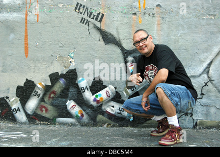 Portrait of world famous graffiti artist in front of his work at 5 Pointz in Long Island City, Queens, New York Stock Photo
