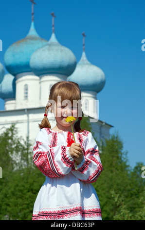 Russian little girl on a orthodox church background. Stock Photo