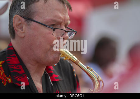 Northampton, UK. 28th July, 2013. Northampton's 7th Music Festival underway. 5 stages are set up around the town to showcase local musicians,  they started playing at midday and goes on goes on until 2200 hrs. This is the Market Square were the main stage is with crowds enjoying the music and good weather. Credit:  Keith J Smith./Alamy Live News Stock Photo