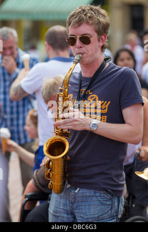 Northampton, UK. 28th July, 2013. Northampton's 7th Music Festival underway. 5 stages are set up around the town to showcase local musicians,  they started playing at midday and goes on goes on until 2200 hrs. This is the Market Square were the main stage is with crowds enjoying the music and good weather. Credit:  Keith J Smith./Alamy Live News Stock Photo