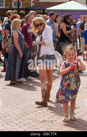 Northampton, UK. 28th July, 2013. Northampton's 7th Music Festival underway. 5 stages are set up around the town to showcase local musicians,  they started playing at midday and goes on goes on until 2200 hrs. This is the Market Square were the main stage is with crowds enjoying the music and good weather. Credit:  Keith J Smith./Alamy Live News Stock Photo