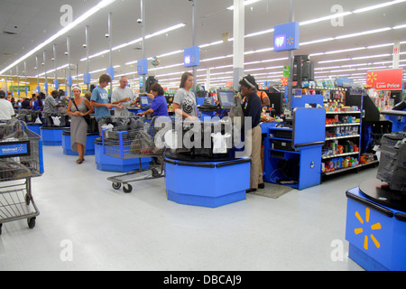 Florida Hallandale Beach,Walmart Wal-Mart,interior inside,check out counters,cashiers,looking FL130720236 Stock Photo