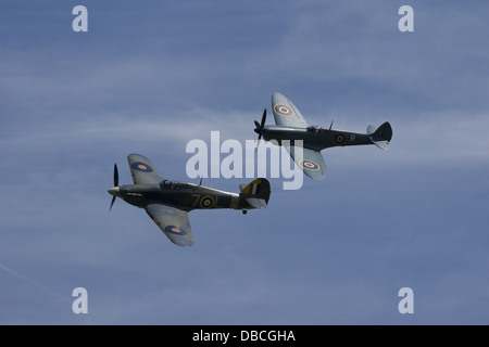 Supermarine Spitfire and Hawker Sea Hurricane in formation at air display Stock Photo