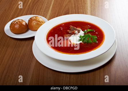 ukrainian and russian red-beet soup (borscht) with garlic and sour cream Stock Photo