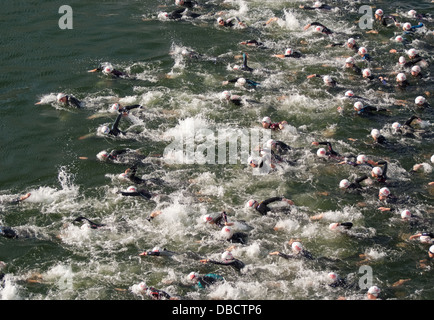 Competitors making a splash as they set off on a 1500km swim in the male Olympic sub at the 2013 Virgin Active London Triathlon. Stock Photo