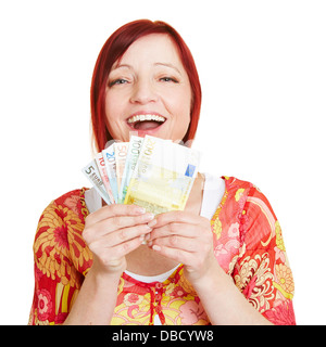 Successful woman with fan of Euro money bills Stock Photo