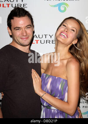 Petra Nemcova with her boyfriend Simon Atlee 'Beauty Culture' Photographic Exploration held at the Annenberg Space for Photography Century City, California - 19.05.11 Stock Photo