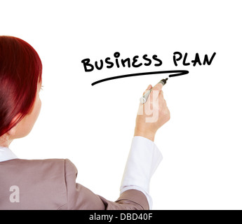 Woman writing the word Business Plan with a pen Stock Photo