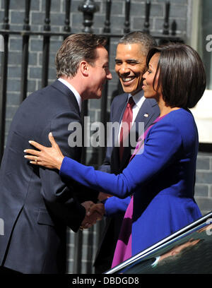 US President Barack Obama arrives at 10 Downing Street with wife Michelle, greeted by Prime Minister David Cameron and his wife Samantha. London, England - 24.05.11 Stock Photo