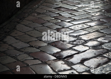 Old shining stone pavement surface background Stock Photo