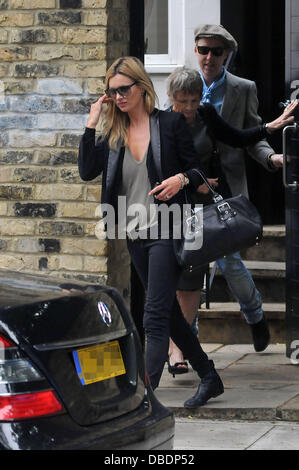 Kate Moss and hairdresser James Brown leaving her house to go away for