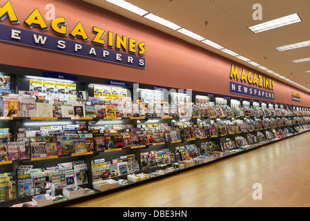 Newspaper in the magazine rack Stock Photo - Alamy