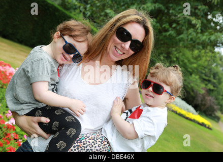 Mum having fun with daughters Stock Photo - Alamy