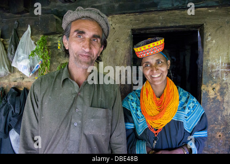 Panchagul and Mariambibi, brother and sister at a house in Kalasha Grum village, Rumbur Valley, Chitral, Khyber-Pakhtunkhwa, Pakistan Stock Photo