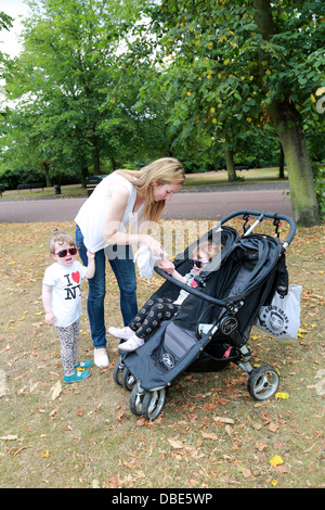 Mother with twin girls Stock Photo