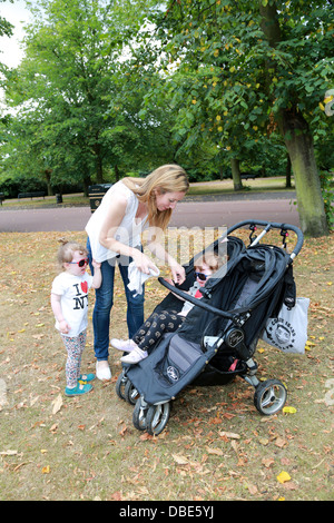 Mother with twin girls Stock Photo