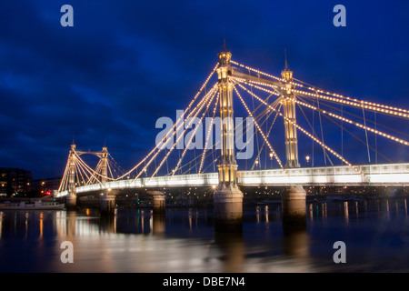 Albert Bridge and River Thames at twilight / dusk / night Chelsea London England UK Stock Photo