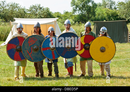 Viking warriors preparing for battle at Flag Fen Archaeological Park, Peterborough, England Stock Photo