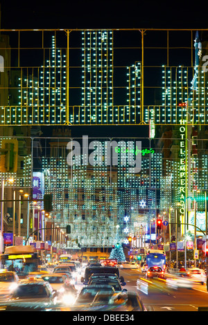 Traffic at Gran via street with string lights at Christmas time. Madrid. Spain. Stock Photo