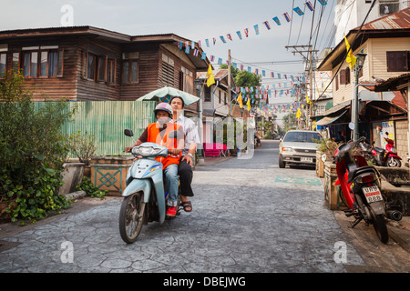 Unidentified man on a motorbike in the Thai capital Stock Photo