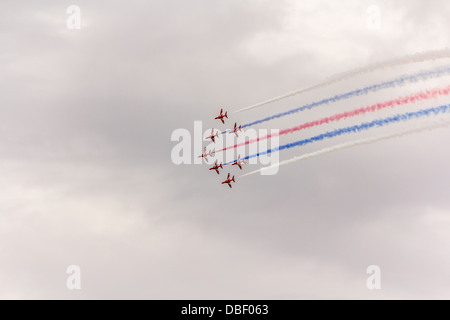 The Red Arrows aerobatics team giving a flight display Stock Photo