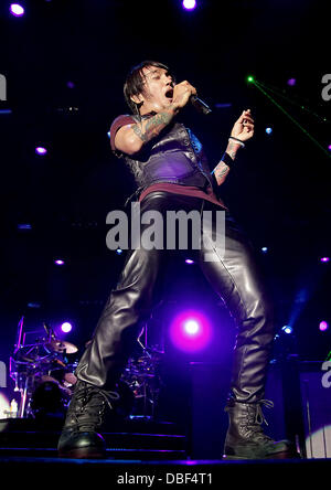 Arnel Pineda of Journey performing at Manchester MEN Arena on their 'Don't Stop Believin' Tour. Manchester, England - 08.06.11 Stock Photo