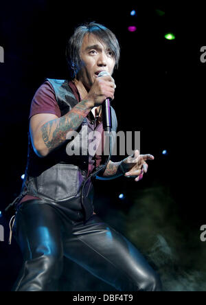 Arnel Pineda of Journey performing at Manchester MEN Arena on their 'Don't Stop Believin' Tour. Manchester, England - 08.06.11 Stock Photo