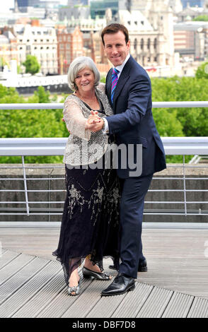 Ann Widdecombe and Anton du Beke join forces with Bupa at the National Theatre to encourage older people to dance their way to better health. Former politician and 2010 Strictly Come Dancing contestant Ann Widdecombe and professional ballroom dancer Anton du Beke are joining Bupa to help launch the initiative and offer dance demonstrations to Bupa care home residents. London, Engla Stock Photo