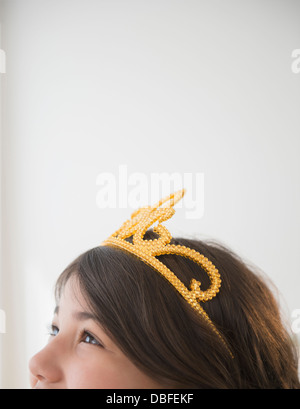 Hispanic girl wearing tiara Stock Photo