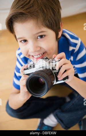 Hispanic boy taking pictures Stock Photo