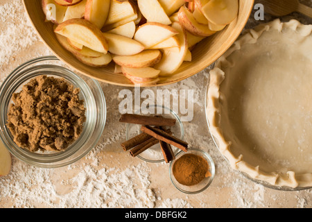 Close up of apples, spices and empty pie shell Stock Photo