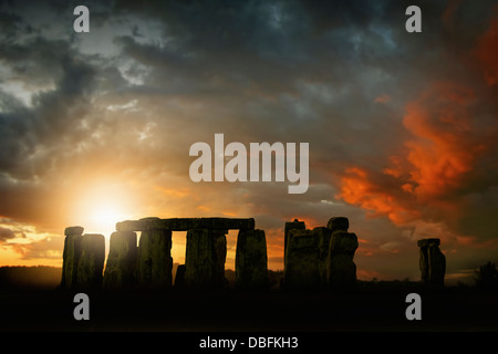 Sun rising over Stonehenge, Wiltshire, United Kingdom Stock Photo